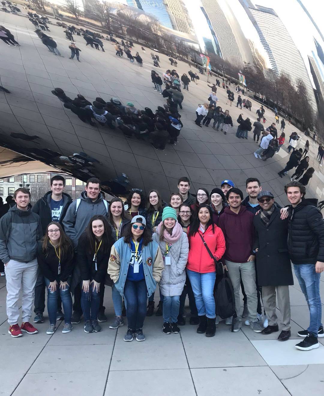 Spanish Club Chicago trip, students in front of Bean at Millennium Park